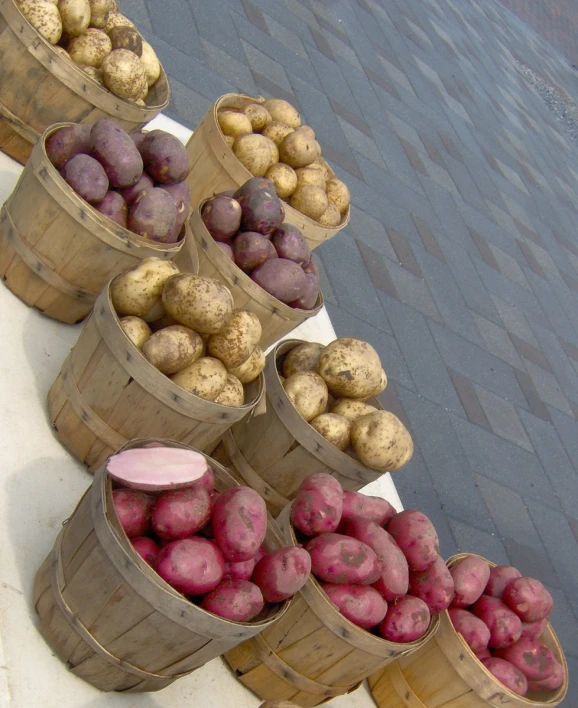 the colorful potatoes are arranged in a tower