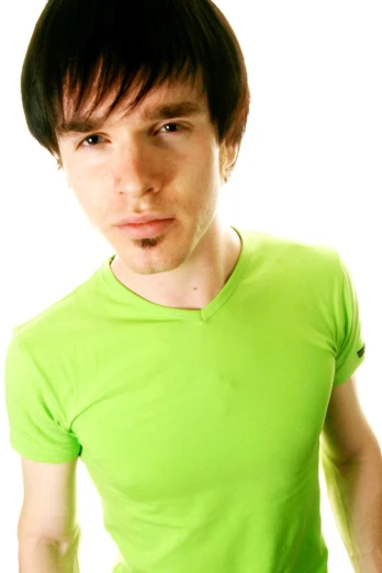 a man in green shirt looking straight into the camera