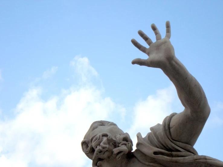 this is a statue of a hand reaching for soing