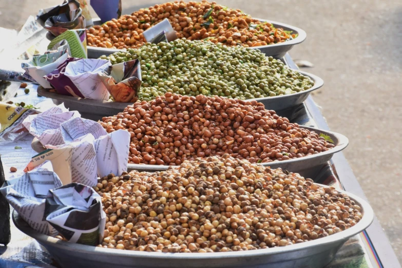 a display of food that is in metal dishes