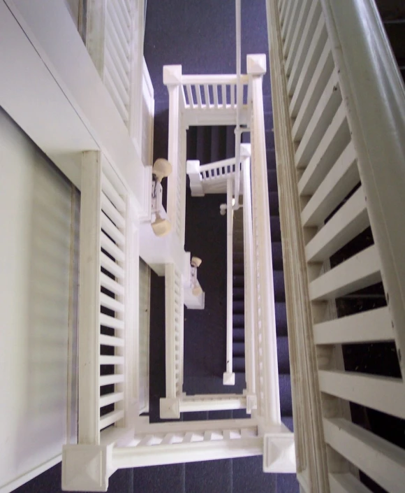 the view down from the upper deck onto a spiral staircase