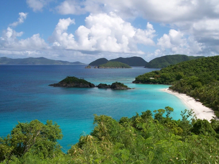 a beautiful blue water beach on an island near the ocean