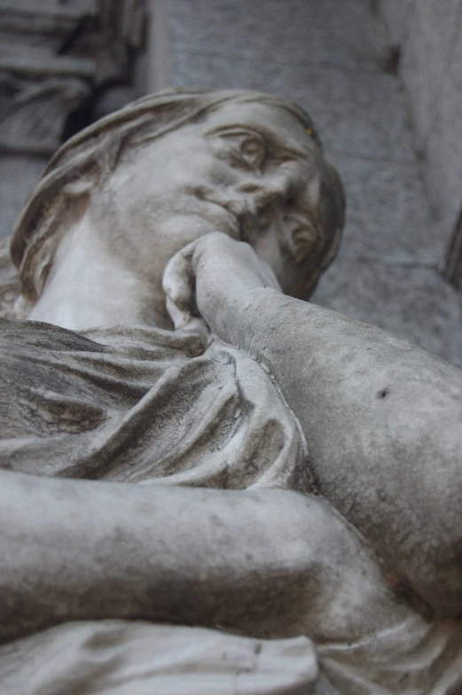 a statue is shown sitting on the ground