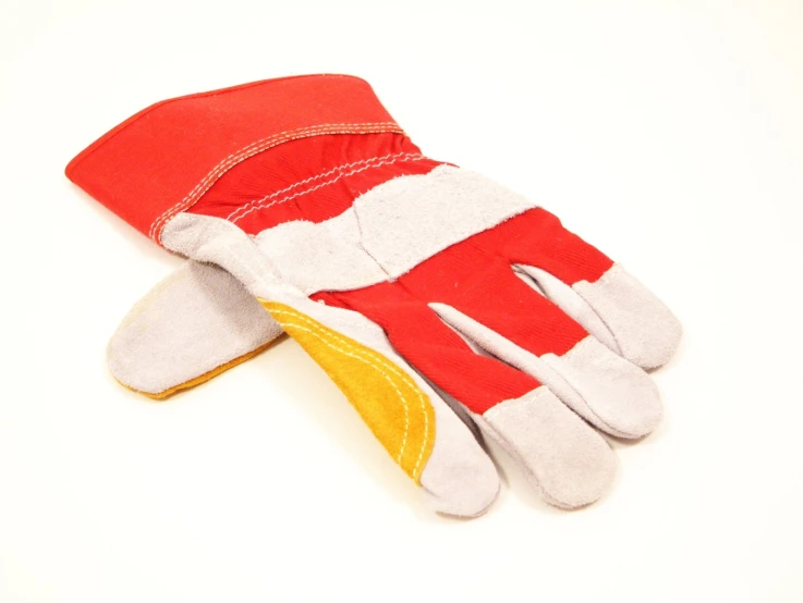 a pair of gloves with two pairs of red and white working gloves
