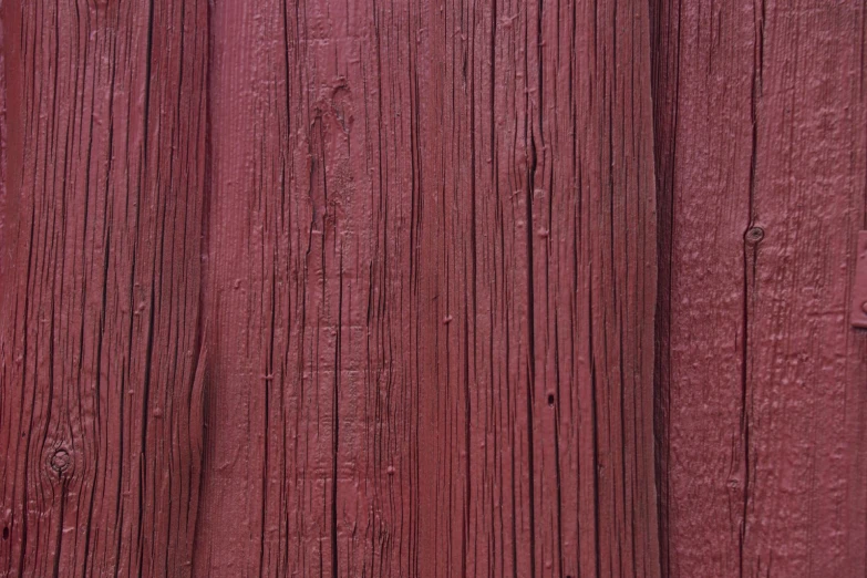 closeup of old red wooden fence