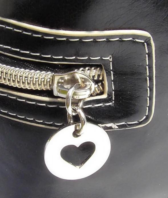 the side of a purse with heart in the middle