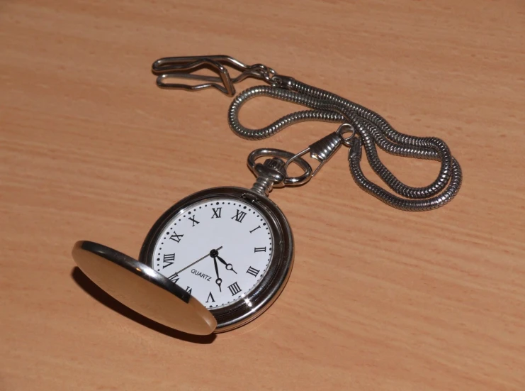 an alarm clock that is attached to a necklace