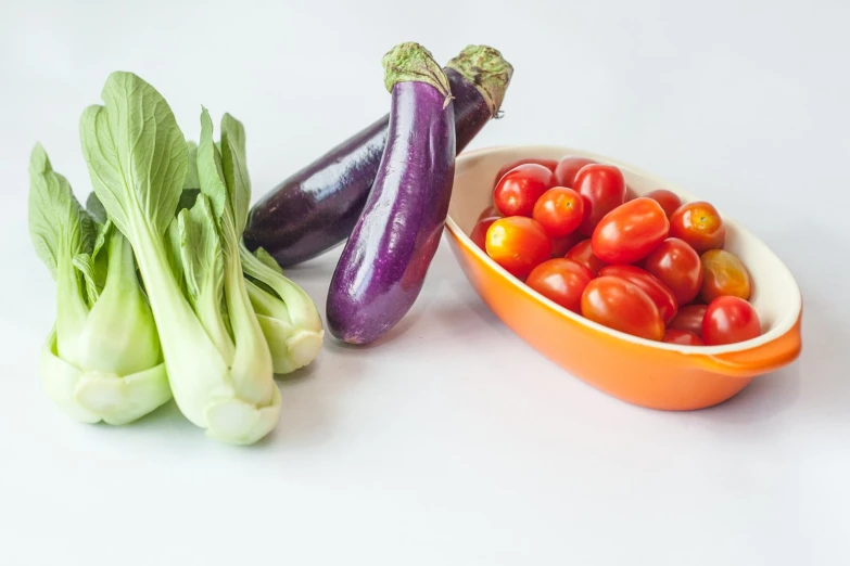 assorted vegetables including broccoli, zucchini and carrots sit next to each other