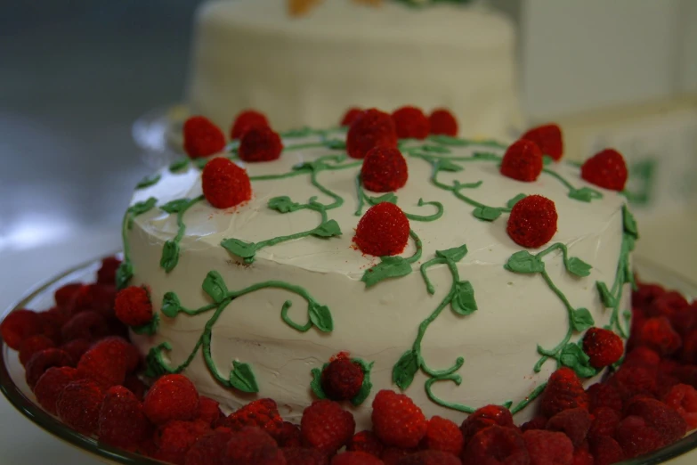 a white cake with berries on top of it