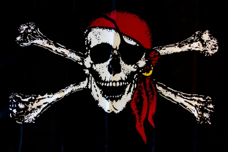 a pirates skull and crossed bones are painted on a black surface