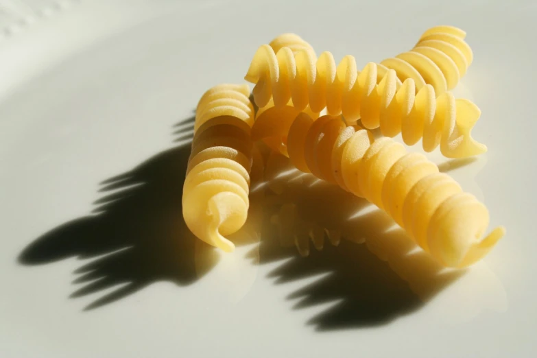 some type of pasta is in the shadow