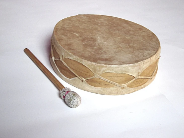 an image of a drum and its wooden sticks