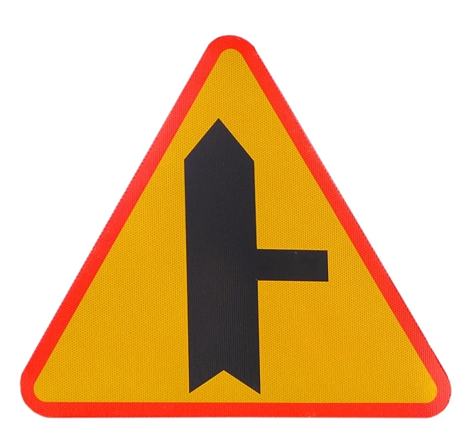 a yellow, triangular sign with an upside down arrow