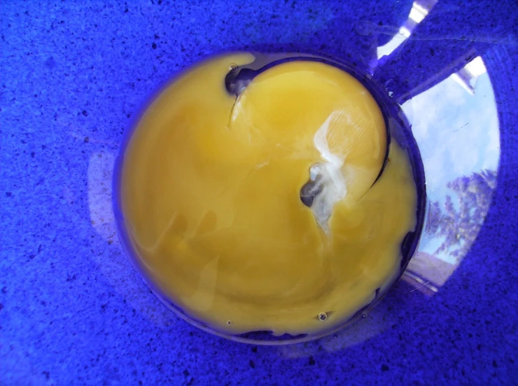 an apple sitting in the center of blue counter