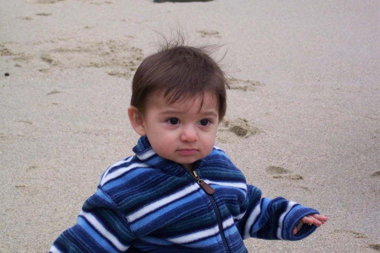 a little boy with a funny look on his face