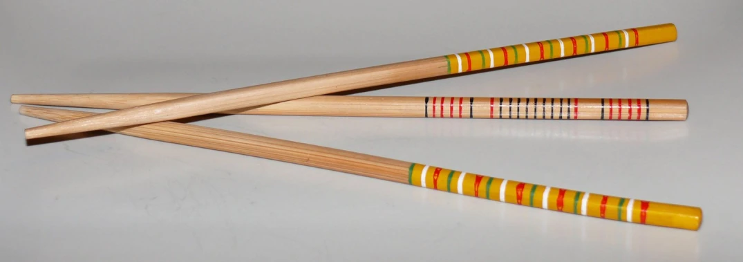 three colored wood mallets placed side by side