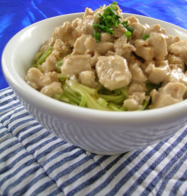 the bowl contains broccoli and meat with gravy