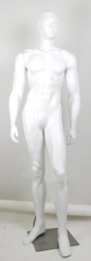 a white mannequin is standing on the ground