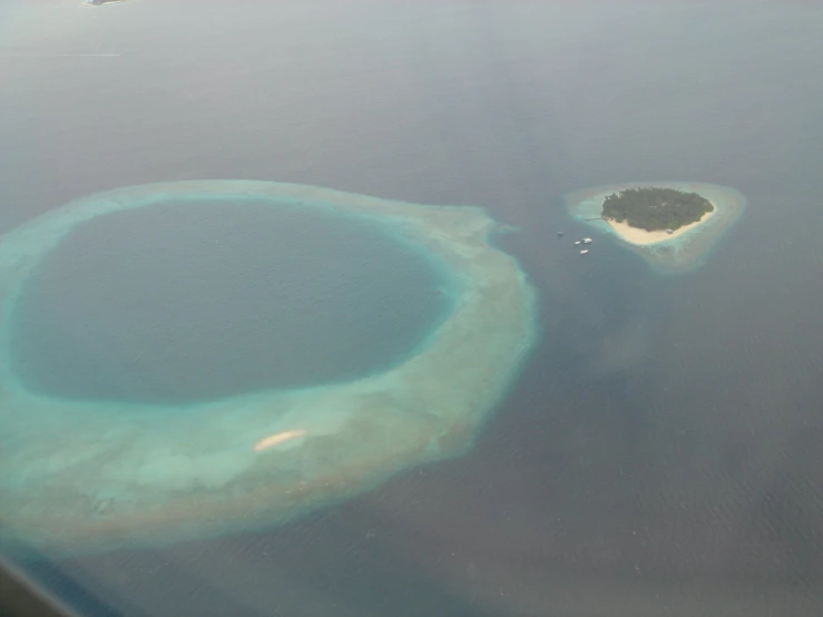 a large object floating on top of water near land