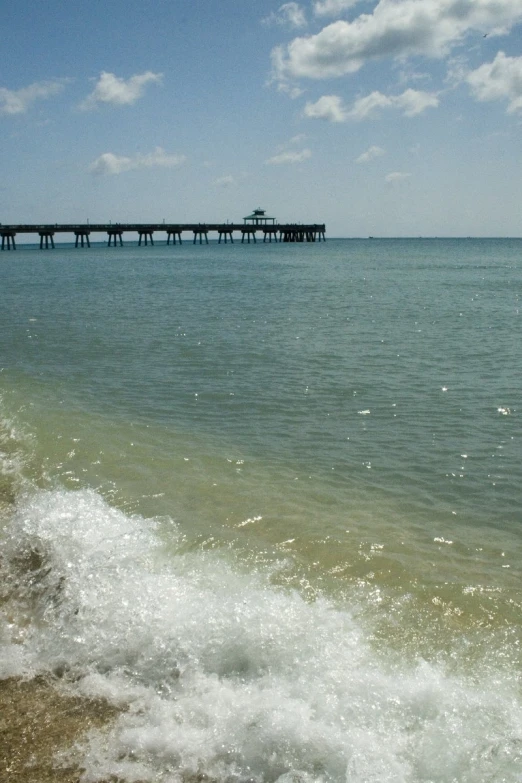 a pier is seen out into the ocean