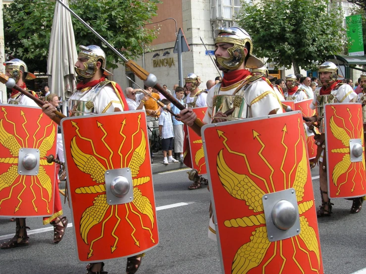 a group of people in costume marching down a street