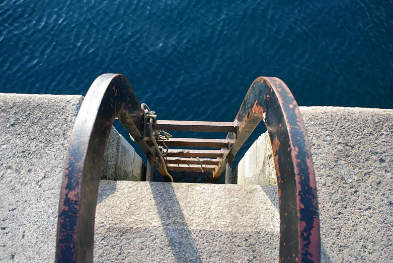 an aerial view from above of a stair case and water