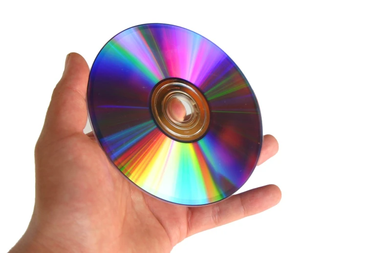 the cd in hand is colorfully shaped