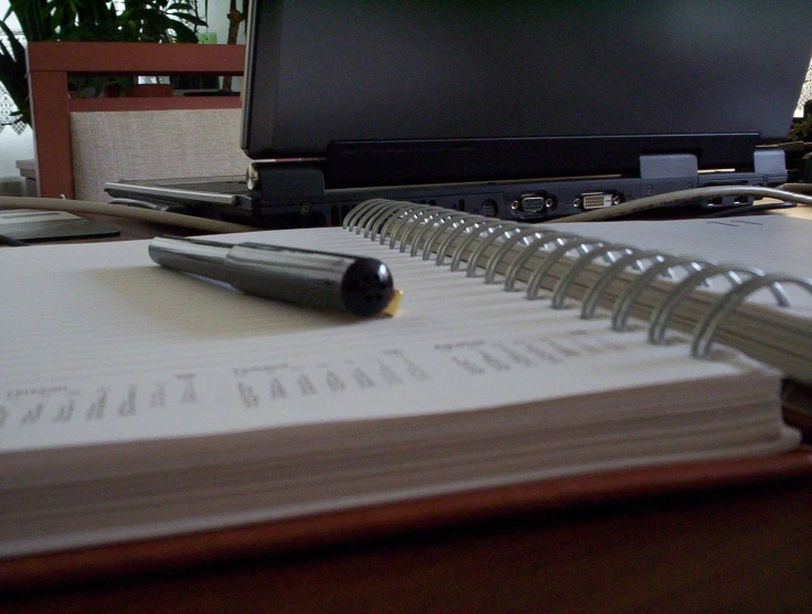 an open book sitting on top of a wooden table