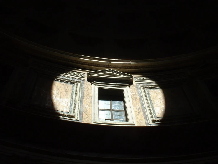 a window with a sunlit opening into it