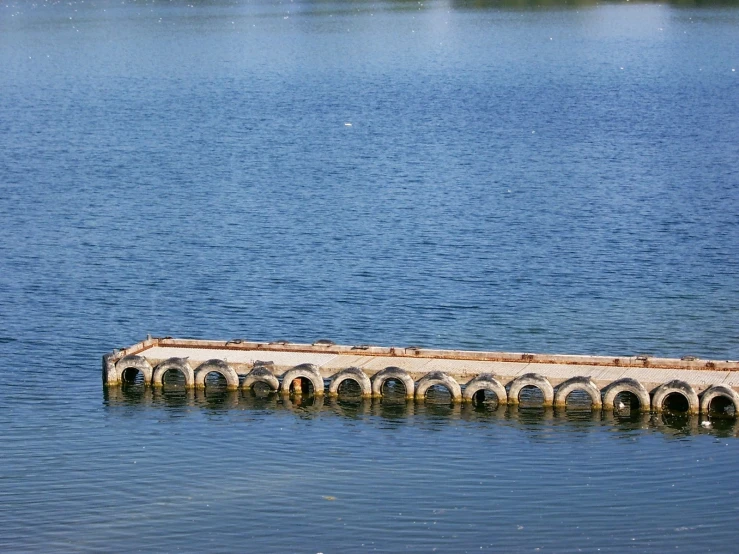 a building that looks like it is sitting in the water