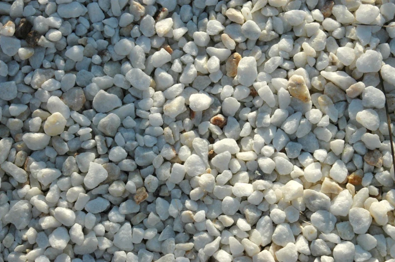 white gravel and rocks laid out next to each other