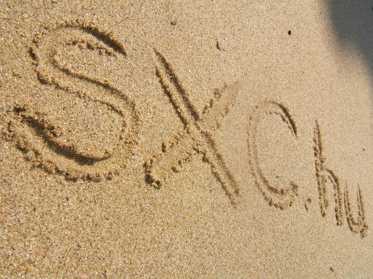a sand message that says 2012 written on it