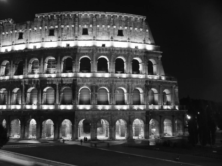 black and white pograph of a roman ampyr amp at night