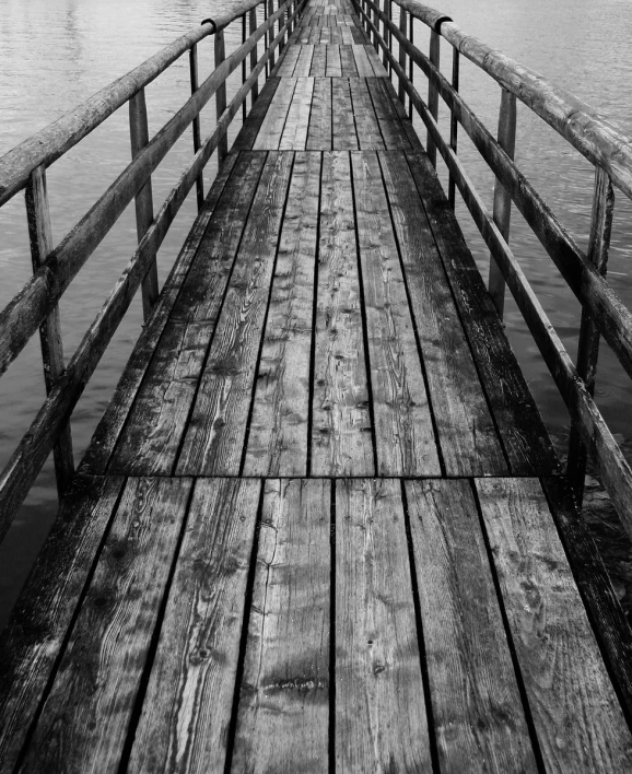 an old wooden pier extending into the ocean