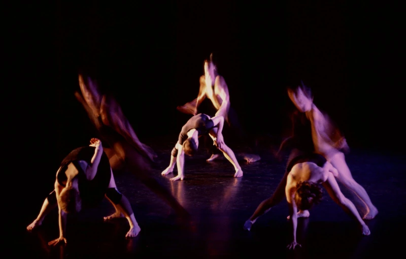 several different positions in a dance performance with a dark background