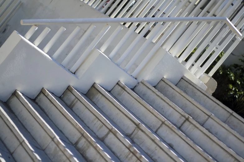 many stairs with different designs on them and white railings