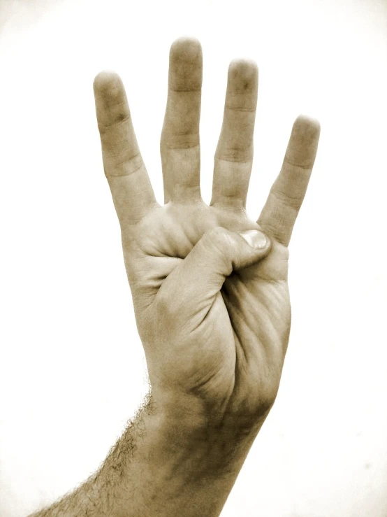 a person's hand with a number on it