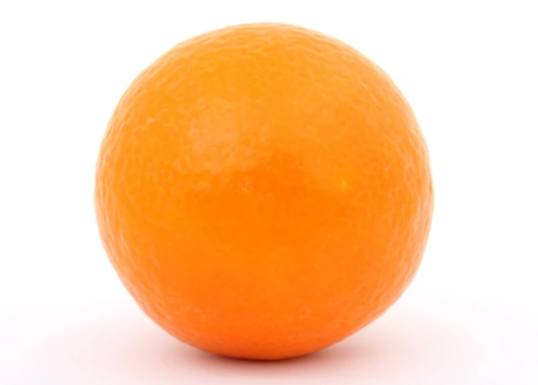 a close up po of an orange isolated on a white background