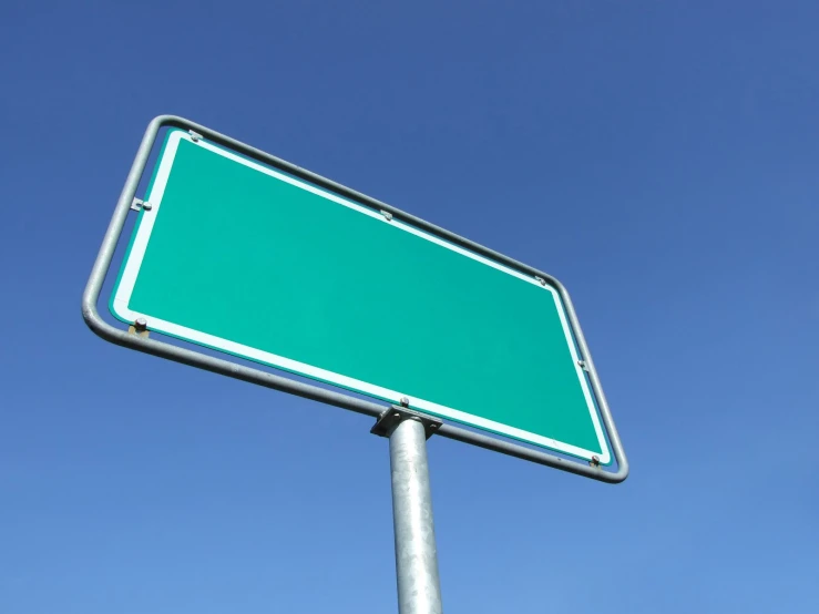 an image of a green sign on a pole