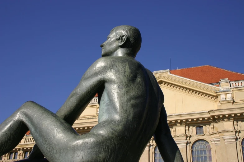 a statue of a man outside a building