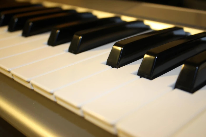 a close up of piano keys of the piano