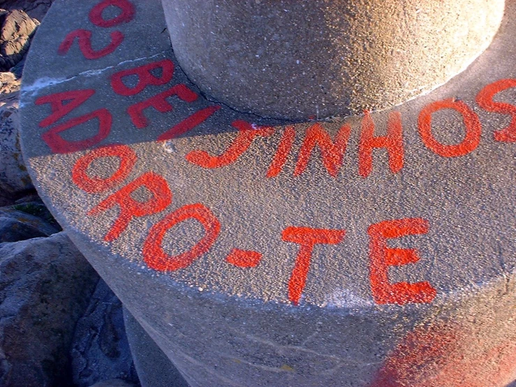 a stone pillar with a word written on it