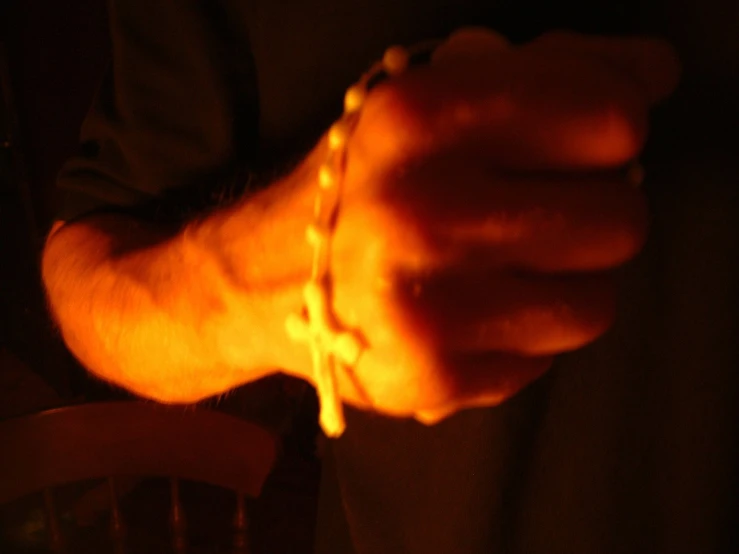 a person with two hands with celets on