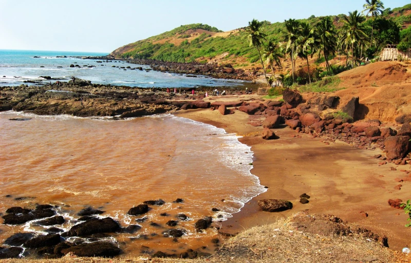 a beach that has rocks and some water