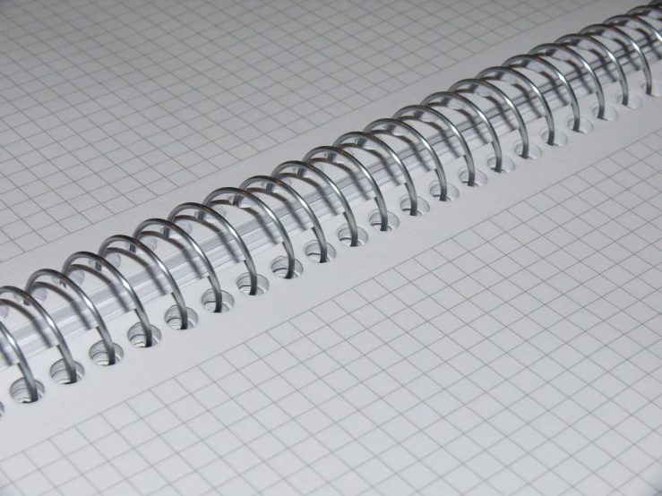 a closeup view of a notebook with spirals
