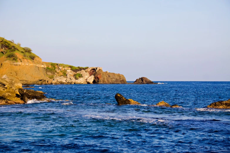 a rocky coast with large rocks and water
