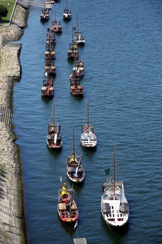 some boats floating in the water on a sunny day