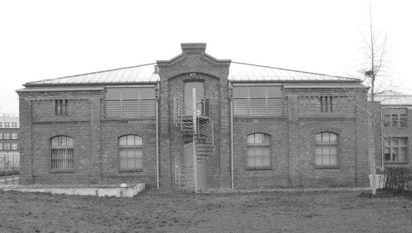 old brick building with a fire escape outside