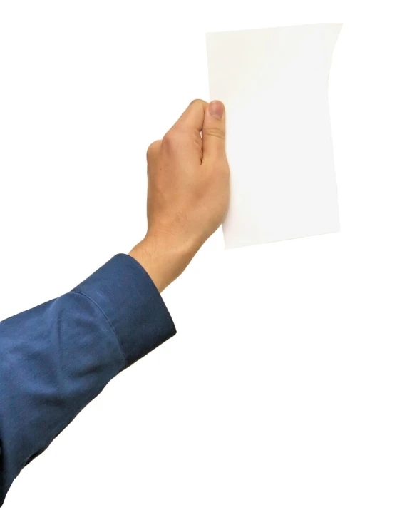 a person's hand holding up a piece of paper