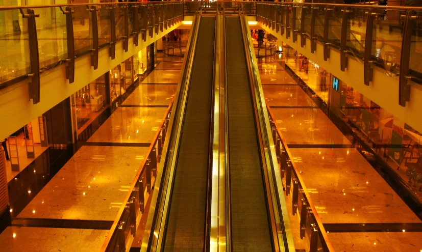 a large empty airport walkway during the night